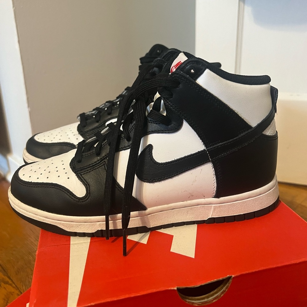 High top Nike Panda Dunks.